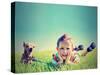 A Boy and a Tiny Chihuahua in the Grass-graphicphoto-Stretched Canvas