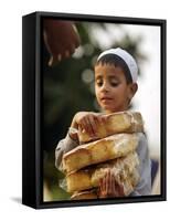 A Boy Carries Rusk as He Assists Others to Send a Consignment of Relief Supplies to Uri-null-Framed Stretched Canvas