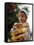 A Boy Carries Rusk as He Assists Others to Send a Consignment of Relief Supplies to Uri-null-Framed Stretched Canvas