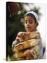A Boy Carries Rusk as He Assists Others to Send a Consignment of Relief Supplies to Uri-null-Stretched Canvas