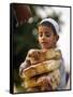 A Boy Carries Rusk as He Assists Others to Send a Consignment of Relief Supplies to Uri-null-Framed Stretched Canvas