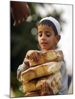 A Boy Carries Rusk as He Assists Others to Send a Consignment of Relief Supplies to Uri-null-Mounted Premium Photographic Print