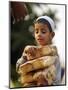 A Boy Carries Rusk as He Assists Others to Send a Consignment of Relief Supplies to Uri-null-Mounted Photographic Print