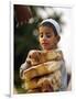 A Boy Carries Rusk as He Assists Others to Send a Consignment of Relief Supplies to Uri-null-Framed Photographic Print