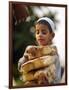 A Boy Carries Rusk as He Assists Others to Send a Consignment of Relief Supplies to Uri-null-Framed Photographic Print