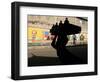 A Boy Carrying Bottles on His Head Passes by a Wall with Pictures of Haitian President Renel Preval-Ariana Cubillos-Framed Photographic Print