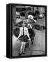 A Boy Gives a Ride to a Little Girl and a 9-Foot Teddy Bear at the Opening of the British Toy Fair-null-Framed Stretched Canvas