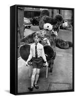 A Boy Gives a Ride to a Little Girl and a 9-Foot Teddy Bear at the Opening of the British Toy Fair-null-Framed Stretched Canvas