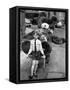 A Boy Gives a Ride to a Little Girl and a 9-Foot Teddy Bear at the Opening of the British Toy Fair-null-Framed Stretched Canvas