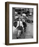 A Boy Gives a Ride to a Little Girl and a 9-Foot Teddy Bear at the Opening of the British Toy Fair-null-Framed Photographic Print