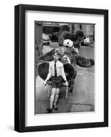 A Boy Gives a Ride to a Little Girl and a 9-Foot Teddy Bear at the Opening of the British Toy Fair-null-Framed Photographic Print