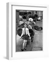 A Boy Gives a Ride to a Little Girl and a 9-Foot Teddy Bear at the Opening of the British Toy Fair-null-Framed Photographic Print