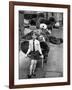 A Boy Gives a Ride to a Little Girl and a 9-Foot Teddy Bear at the Opening of the British Toy Fair-null-Framed Photographic Print