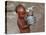 A Boy in a Slum Along the Yamuna River in the Older Part of New Delhi Drinks Water from a Tea Pot-null-Stretched Canvas