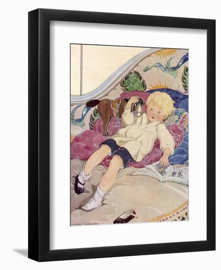 A Boy Lying on a Bed with a Book and a Toy Horse-Anne Anderson-Framed Art Print