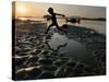 A Boy Plays on the Banks of the River Brahmaputra in Gauhati, India, Friday, October 27, 2006-Anupam Nath-Stretched Canvas