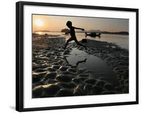 A Boy Plays on the Banks of the River Brahmaputra in Gauhati, India, Friday, October 27, 2006-Anupam Nath-Framed Photographic Print