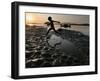 A Boy Plays on the Banks of the River Brahmaputra in Gauhati, India, Friday, October 27, 2006-Anupam Nath-Framed Photographic Print