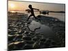 A Boy Plays on the Banks of the River Brahmaputra in Gauhati, India, Friday, October 27, 2006-Anupam Nath-Mounted Photographic Print