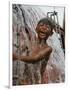 A Boy Takes Advantage of an Overflowing Firetruck Which was Used to Put out a Fire-null-Framed Photographic Print