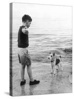 A Boy Throws Stones into the Sea for His Dog to Retrieve: the Dog Looks Up Expectantly-Henry Grant-Stretched Canvas