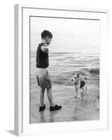 A Boy Throws Stones into the Sea for His Dog to Retrieve: the Dog Looks Up Expectantly-Henry Grant-Framed Photographic Print