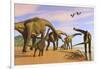 A Brachiosaurus Herd Walks Down a Wet Sandy Beach-null-Framed Art Print