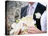 A Bride and Groom with a Glass of Champagne and a Bouquet-null-Stretched Canvas