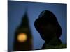 A British Police Officer Stands Guard Outside the Houses of Parliament-null-Mounted Photographic Print