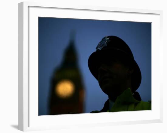 A British Police Officer Stands Guard Outside the Houses of Parliament-null-Framed Photographic Print