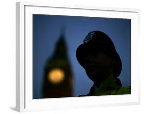 A British Police Officer Stands Guard Outside the Houses of Parliament-null-Framed Photographic Print