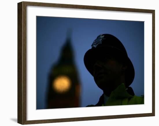 A British Police Officer Stands Guard Outside the Houses of Parliament-null-Framed Photographic Print