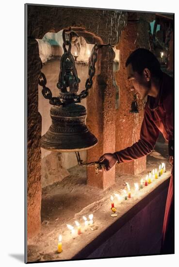 A Buddhist Monk Rings a Prayer Bell During the Full Moon Celebrations-Andrew Taylor-Mounted Photographic Print
