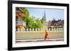 A buddhist monk walks past Wat Si Saket (Wat Sisaket) temple in central Vientiane, Laos-Jason Langley-Framed Photographic Print