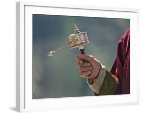 A Buddhist Spins His Hand-Held Prayer Wheel in a Clockwise Direction with the Help of a Weighted Ch-Nigel Pavitt-Framed Photographic Print