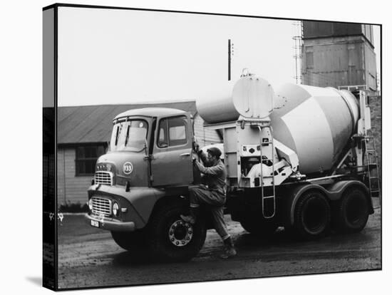 A Builder Climbing into a Ready-Mix Concrete Transporter Lorry-null-Stretched Canvas