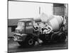 A Builder Climbing into a Ready-Mix Concrete Transporter Lorry-null-Mounted Photographic Print