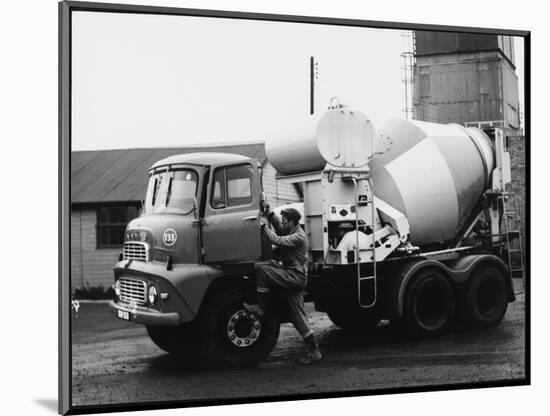 A Builder Climbing into a Ready-Mix Concrete Transporter Lorry-null-Mounted Photographic Print