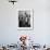 A Butcher Working in the Hungarian Meat Shop-John Phillips-Framed Premium Photographic Print displayed on a wall