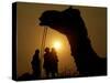 A Camel Stands as Villagers Walk at Sunrise at the Annual Cattle Fair in Pushkar, November 3, 2006-Rajesh Kumar Singh-Stretched Canvas