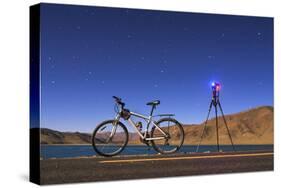 A Camera, Tripod and Bicycle on a Full Moon Night at Yamdrok Lake, Tibet, China-Stocktrek Images-Stretched Canvas