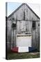 A Canoe Sits In Front Of A Weathered Old Boat House On The Coast Of Maine-Erik Kruthoff-Stretched Canvas