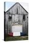 A Canoe Sits In Front Of A Weathered Old Boat House On The Coast Of Maine-Erik Kruthoff-Stretched Canvas