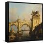 A Capriccio of a ruined Renaissance Arcade and Pavillion by a Waterway-Canaletto-Framed Stretched Canvas