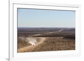 A Car Leaves a Cloud of Dust as it Apporachs Along the Long Dusty Road from the Fish River Canyon-Alex Treadway-Framed Photographic Print