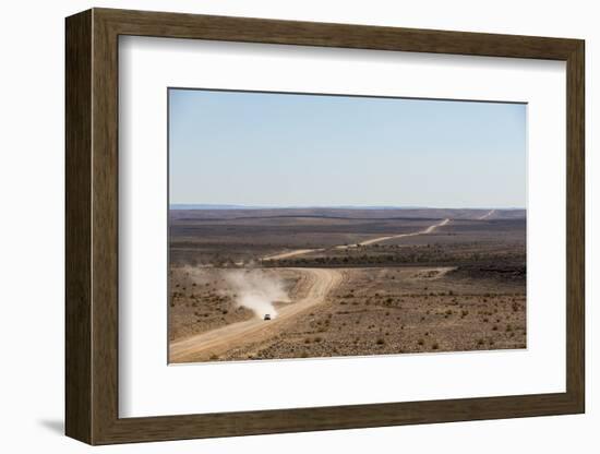 A Car Leaves a Cloud of Dust as it Apporachs Along the Long Dusty Road from the Fish River Canyon-Alex Treadway-Framed Photographic Print