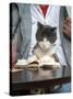 A Cat Joins its Owner Reading a Book at a Tokyo Cafe-null-Stretched Canvas