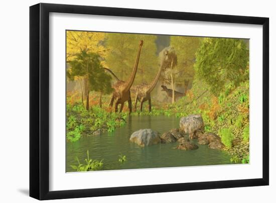 A Ceratosaurus Tries to Sneak Up Behind Two Diplodocus Dinosaurs-Stocktrek Images-Framed Art Print