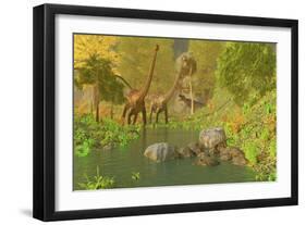 A Ceratosaurus Tries to Sneak Up Behind Two Diplodocus Dinosaurs-Stocktrek Images-Framed Art Print