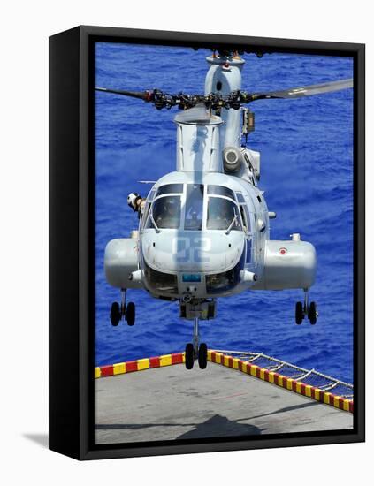 A CH-46E Sea Knight Helicopter Prepares To Land On the Flight Deck of USS Peleliu-Stocktrek Images-Framed Stretched Canvas
